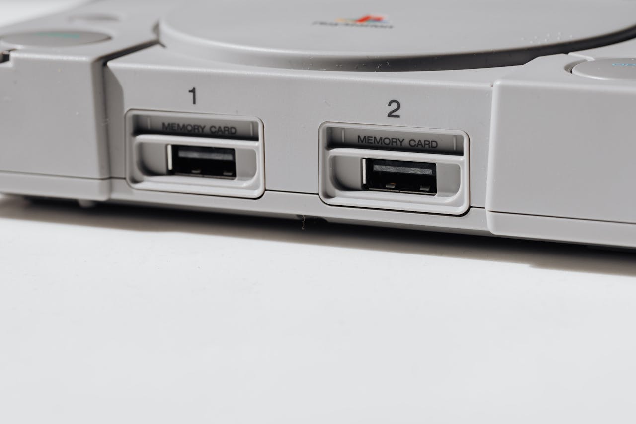 Detailed view of vintage PlayStation console featuring memory slots, capturing nostalgia.